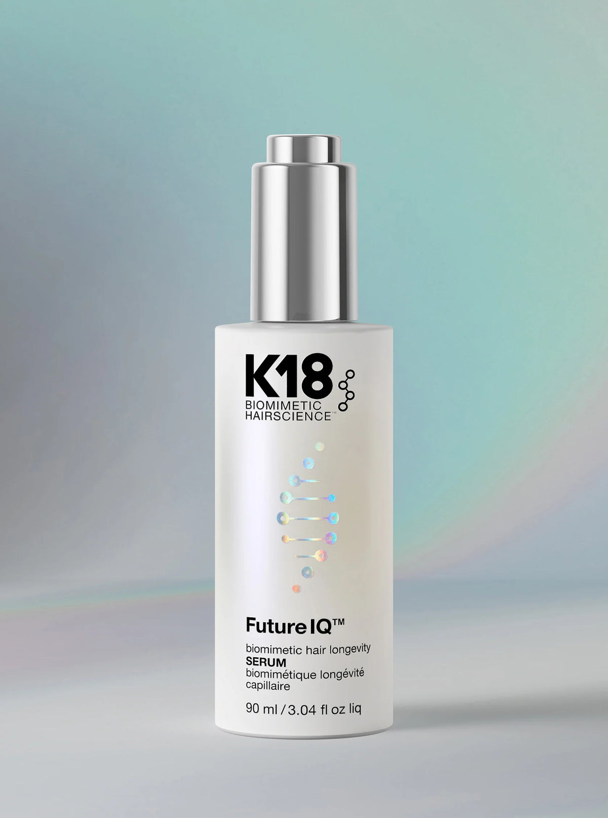 K18 hair serum dropper bottle on a gradient background