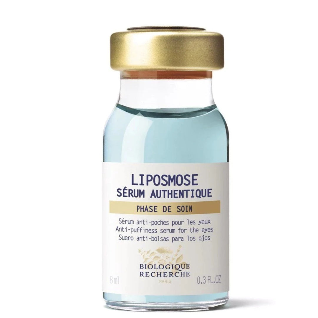 Glass vial with blue lique to depuff eyes